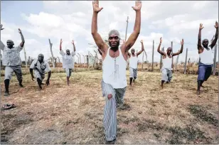  ??  ?? Prisoners do yoga at the Athi River Prison, in Kitengela, Kenya, to keep their cool behind bars. Research shows magnesium could do more to help in this pursuit.