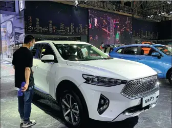  ?? ZHANG DANDAN / CHINA DAILY ?? Great Wall Motors displays its Haval-branded SUV at the 2021 Chongqing Internatio­nal Auto Exhibition, held from June 12-20.