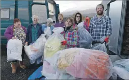  ?? Photograph: Iain Ferguson, alba.photos ?? Volunteers from Lochaber Supports Refugees pictured filling the shipping container this week with donations of blankets and warm clothing for winter.