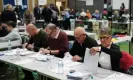  ?? Photograph: Jacob King/PA ?? Ballot papers are checked and verified by count staff for the Tamworth byelection at The Rawlett School, Tamworth, 19 October 2023.