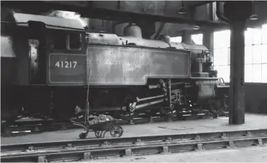  ?? Keith Widdowson/ANISTR.COM ?? Push-pull fitted No 41217 simmers within its home shed, the roundhouse of Carlisle (Upperby), while awaiting its next call of duty on 31 March 1966. The first 11 Ivatt 2-6-2Ts of the BR era were push-pull fitted, Nos 41210-20. Used on pilot work in Carlisle, the Ivatt ‘2MTs’ had performed well, and this one went on to be in the last five members of its class on the London Midland Region. None would remain on the LMR books after the week ending 31 December 1966, which was the official withdrawal period of the pictured locomotive.