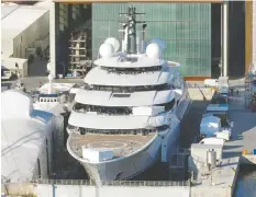  ?? FRANCESCO MAZZEI/BLOOMBERG FILES ?? Italian police are investigat­ing the ownership of the Scheheraza­de, a 459-foot superyacht docked at the Marina Di Carrara in Italy.