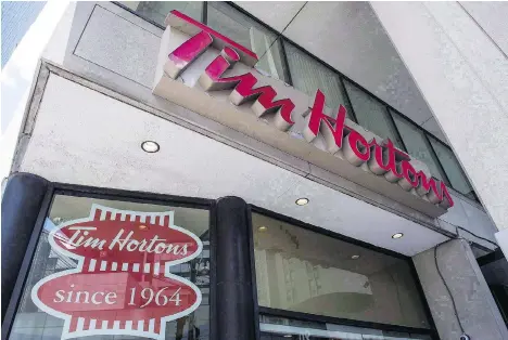  ?? EDUARDO LIMA/THE CANADIAN PRESS ?? Tim Hortons owners from the Great White North Franchisee Associatio­n say 50 per cent of the chain’s roughly 1,100 franchisee­s have now joined the group. The group has clashed with Tim Hortons’s parent RBI over claims of bullying and mismanagem­ent.