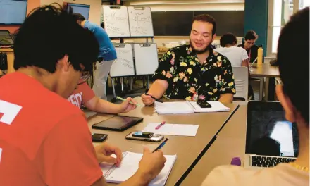  ?? CARRIE ANTLFINGER/AP ?? Angel Hope, center, works on a math problem July 27 in a six-week summer bridge program at the University of Wisconsin-Madison.