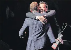  ?? JIM WEBER/THE COMMERCIAL APPEAL ?? Pop music star and actor Justin Timberlake gets a hug from “The Tonight Show” host Jimmy Fallon during his induction into the Memphis Music Hall of Fame Saturday night.