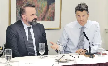  ?? NICK PROCAYLO ?? Daniel Firth, left, seen with Vancouver Mayor Gregor Robertson on Tuesday, will be the executive director of the independen­t mobility pricing commission, which will make recommenda­tions next spring.