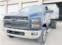  ??  ?? A 2019 Chevrolet Silverado 6500 HD Chassis Cab truck is upfitted with a dump body for commercial use.