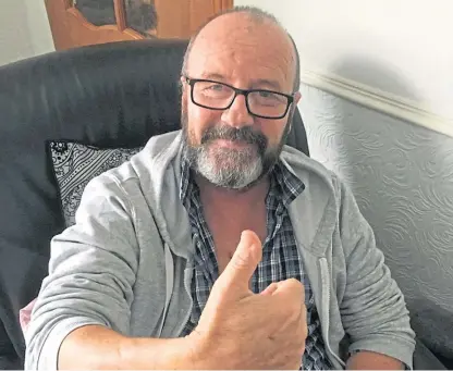  ??  ?? Thumbs up from Alan Mowatt who is recuperati­ng at home after a triple bypass operation.