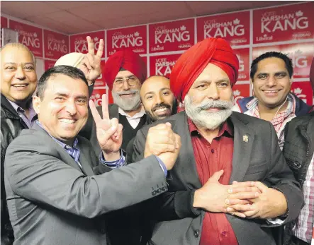  ?? CHRISTINA RYAN/ CALGARY HERALD ?? Liberal candidate Darshan Kang for Calgary’s Skyview constituen­cy greets volunteers at his campaign office in Calgary on election night as he awaited word on the final election results.