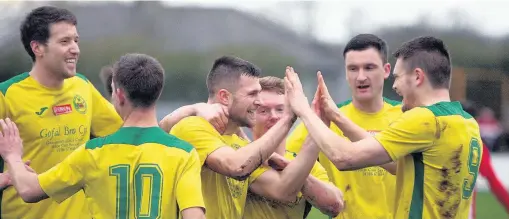  ??  ?? ● Caernarfon Town celebrate Danny Brookwell’s goal against Holywell. Picture: RICHARD BIRCH