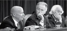  ?? ASSOCIATED PRESS ?? HOUSE WAYS AND MEANS COMMITTEE CHAIRMAN KEVIN BRADY, R-Texas, (left) joined by Rep. Richard Neal, D-Mass., the ranking member, and Rep. Sander Levin, D-Mich., offers his manager’s amendment as the GOP tax bill debate enters the final stage, on Capitol...