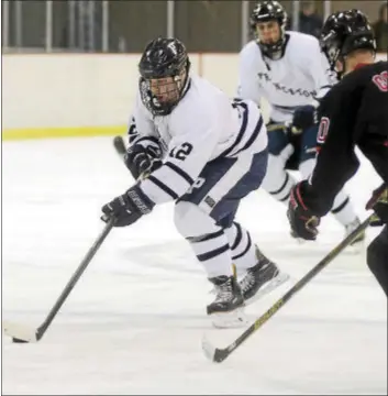  ?? GREGG SLABODA — TRENTONIAN PHOTO ?? Princeton’s Brendon McCormick, left, controls the puck against Robbinsvil­le during MCT semifinal action.