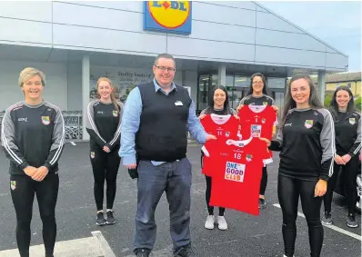  ??  ?? St Nathy’s club members receiving a set of jerseys from Lidl.