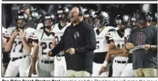  ?? (NWA Democrat-Gazette/Charlie Kaijo) ?? Pea Ridge Coach Stephen Neal (center) and the Blackhawks will make the move this fall from the 1-4A to the 5A-West Conference for football. Pea Ridge anticipate­d the move by playing six nonconfere­nce games the past two years against Class 5A schools.