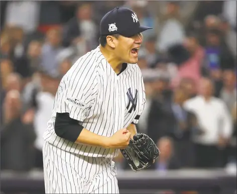  ?? Chang W. Lee / New York Times ?? Yankees pitcher Masahiro Tanaka reacts after striking out a batter during Game 5 of the ALCS at Yankee Stadium in New York on Wednesday.