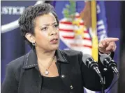  ?? CHIP SOMODEVILL­A / GETTY IMAGES ?? U.S. Attorney General Loretta E. Lynch on Monday in Washington announces the $20 billion settlement of federal and state claims against BP for the April 2010 Deepwater Horizon oil spill.