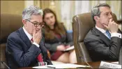  ?? CLIFF OWEN / ASSOCIATED PRESS ?? Fed Chairman Jerome Powell (left) and Vice Chair Randal Quarles, who is the central bank’s supervisio­n chief, listen during a meeting.