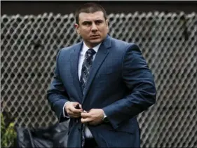  ?? PHOTO/EDUARDO MUNOZ ALVAREZ ?? New York City police officer Daniel Pantaleo leaves his house on Monday, in Staten Island, N.Y. A long-delayed disciplina­ry trial is set to begin Monday for Pantaleo, accused of using a banned chokehold in the July 2014 death of Eric Garner. AP