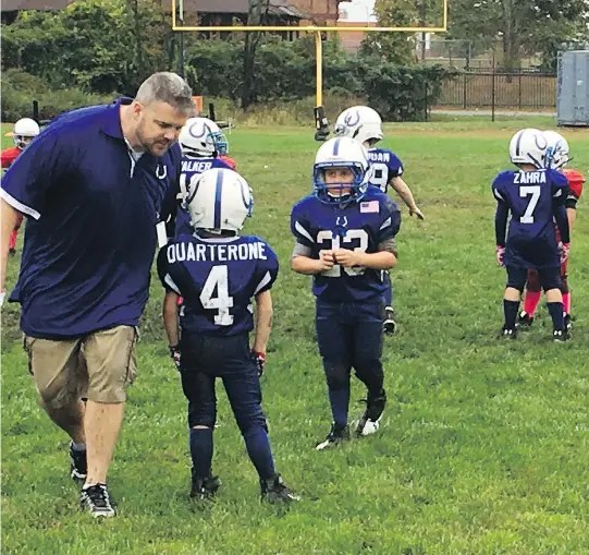  ?? RALPH RUSSO/THE ASSOCIATED PRESS ?? USA Football has introduced a pilot program called Rookie Tackle, a scaled-down version of football with modified rules for young players.