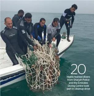  ?? Supplied photo ?? A team of divers pull up a fishing net from the wreckage of MV Dara. —