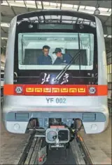  ?? XINHUA XU YANG / ?? Staff workers with the CRRC Changchun Railway Vehicles Co test a subway train to be used in Beijing’s Yanfang Line.