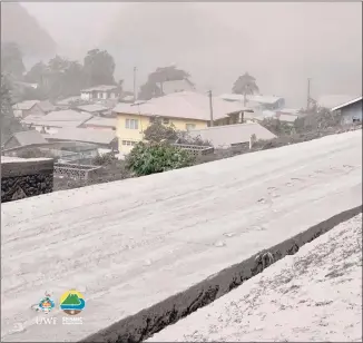  ?? UWI Seismic Research Centre / AFP via Getty Images ?? Homes in Chateaubel­air, St. Vincent, are covered in ash after Friday’s eruption of the La Soufriere volcano.