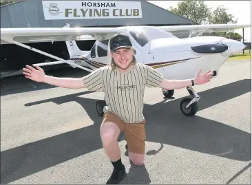  ?? Picture: PAUL CARRACHER ?? TOUCHING THE SKY: Teenager Roland Brooke can now pilot an aircraft solo. He is pictured at Horsham Flying Club headquarte­rs at Horsham aerodrome.