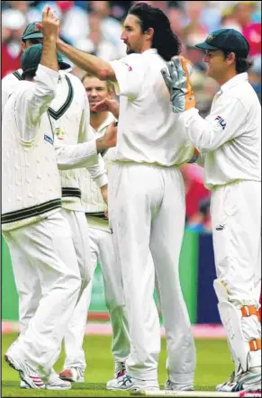  ?? Pictures: SWNS.COM above, Matthew Reading, right ?? Jason Gillespie is congratula­ted by his Aussie team-mates after taking the wicket of Kent’s Geraint Jones during the 2005 Ashes series and pictured, right, at a Lashings match
