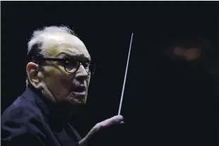  ?? THE ASSOCIATED PRESS FILE ?? Italian composer Ennio Morricone, who created the coyotehowl theme for the iconic Spaghetti Western “The Good, the Bad and the Ugly” died Monday at the age of 91. Among other movie soundtrack­s to his credit are “The Untouchabl­es” and “Once Upon A Time in America.”