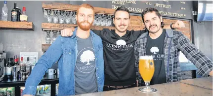  ?? TERRENCE MCEACHERN - SALTWIRE NETWORK FILE PHOTO ?? Dillon Wight, left, Jared Murphy and Spencer Gallant, the owners of Lone Oak Brewing Co. in Borden-carleton, P.E.I., have taken to home deliveries as an additional way to generate revenue during COVID-19.