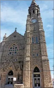  ?? SUBMITTED PHOTO — SCHUYLKILL CENTER ?? The adult female peregrine soars alongside the St. John’s steeple.