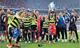  ??  ?? Wembley joy: Huddersfie­ld celebrate winning the Championsh­ip play-off final