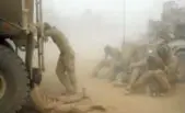  ??  ?? U.S. Marines try to take shelter from a sand storm at a base May 7, 2008, in southern Afghanista­n.