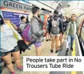  ??  ?? People take part in No Trousers Tube Ride