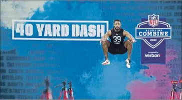  ?? Charlie Neibergall Associated Press ?? TERRELL BURGESS, a defensive back from Utah, prepares to run the 40-yard dash at the 2020 NFL combine. With the 2021 combine canceled, workouts will take place on individual pro days on college campuses.