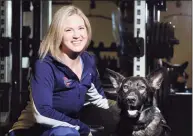  ?? Bob Luckey Jr. / Hearst Connecticu­t Media ?? Greenwich resident Amy Dixon, a triathlete who is blind, with her German Shepherd service dog Woodstock at Combine Training in Greenwich in 2017.