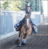  ??  ?? 2017 Stampede princess Ava Padfield waves to the crowd during last Wednesday evening's horsemansh­ip competitio­n for the 2018 crown. Padfield says her role as princess has inspired her to continuing volunteeri­ng now that her reign is over.