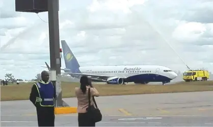  ??  ?? RwandAir receives the water cannon salute soon after landing at Harare Internatio­nal Airport yesterday