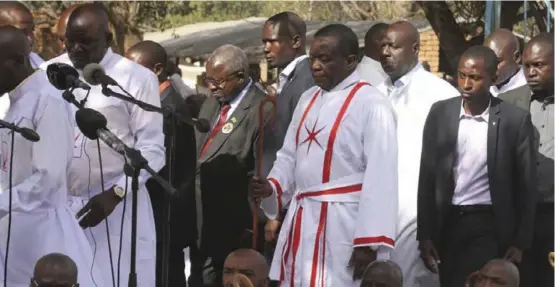  ?? ?? President Emmerson Mnangagwa (holding staff) clad in an apostolic sect attire ahead of 2018 presidenti­al polls.