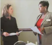  ?? Agnes Hagin/SJ ?? Karen Tinsley, left, and Malisa Thompson, Georgia Department of Community Affairs, gave presentati­ons during an orientatio­n meeting with GICH participan­ts in Rockmart.