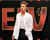  ?? Reuters; EPA ?? Above, Oscarnomin­ated actor Austin Butler wears a white blazer to an Elvis screening; below, singer Shawn Mendes in a sharp threepiece suit at the 2020 Grammy Awards