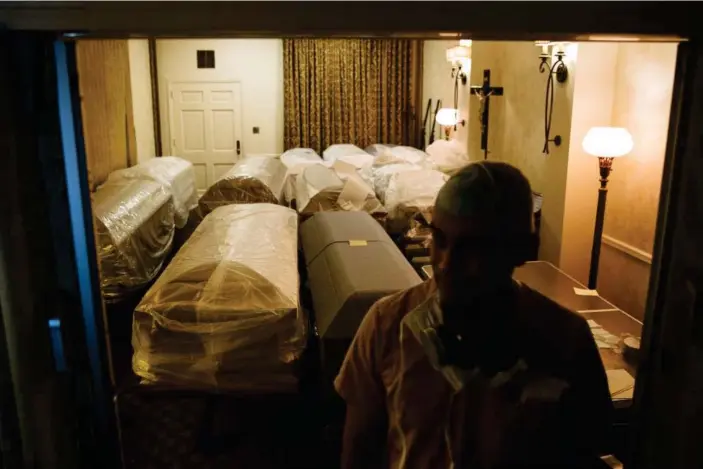  ?? Photograph: Angus Mordant/Bloomberg/Getty Images ?? Empty caskets for victims of Covid-19 at a funeral home in the Queens borough of New York on 29 April.