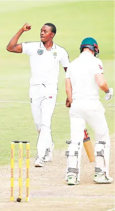  ?? - AFP photo ?? South Africa bowler Kagiso Rabada (L) celebrates taking the wicket of Australia batsman Shaun Marsh during day three of the second cricket test match between South Africa and Australia at St George Park in Port Elizabeth.