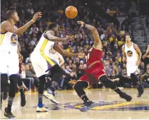  ?? AFP ?? DRAYMOND GREEN, #23 of the Golden State Warriors, fouls LeBron James, #23 of the Cleveland Cavaliers at ORACLE Arena on Jan. 16 in Oakland, California.