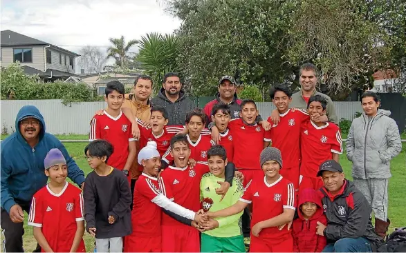  ?? SUPPLIED ?? Vikash Nair, kneeling right, and his champion Papatoetoe AFC Warriors have now scored two Auckland Football age group titles in as many years.