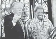 ??  ?? Trump (left) and boxing promoter Don King speak to reporters outside the Mar-a-lago Club in Palm Beach, Florida, US. — Reuters photo