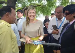  ?? — PTI ?? Queen Maxima of Netherland­s being presented a cricket bat during a visit to a factory in Meerut on Tuesday.