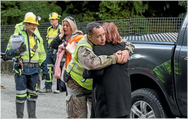  ??  ?? Karl Maddaford embracing Pike River widow Anna Osborne in 2019. Last July he became national manager of critical response at WorkSafe, trying to investigat­e a spate of injuries and deaths at the NZ Defence Force.