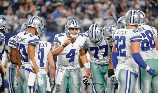  ?? Associated Press file photos ?? Dallas mainstay Tony Romo, left, played in only one game this season because of injury and the emergence of Dak Prescott (4) as the Cowboys’ starting quarterbac­k.