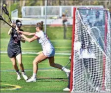  ?? KYLE FRANKO — TRENTONIAN PHOTO ?? Allentown’s Isabella Walker (8) takes a shot on goal while being defended by Lawrencevi­lle’s Olivia Koch (21) during action from this season.